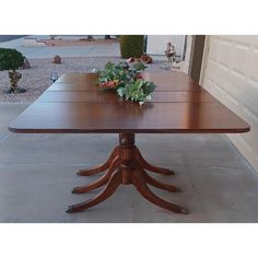 Beautiful 1930s Vintage Mahogany Duncan Phyfe Style Drop-Leaf Table with Triple Pedestal Legs and Antique Brass Lion Claw Foot Toe Caps.  It has two smooth operating spring locks on each drop leaf to raise and lower the leaf.  Style: Traditional Table Shape: Rectangle  Material: Wood   Condition: Good Condition. Original condition unaltered.  Very faint blemishes only on top. Considering its age and rarity, it is in excellent condition. Stands sturdy and secure. The quality and craftsmanship speak volumes. Please view the images provided closely to confirm its condition and outstanding appearance. This table was made in New York City with a blend of English Neoclassical and Regency styles.  Dimensions:  With drop-leaf's down  29" H x 42" W x 26" L                      With leaf's up Vintage Drop Leaf Table Dining Room, Duncan Phyfe Table, Stone Bungalow, Vintage Drop Leaf Table, Lion Claw, Bungalow Cottage, Duncan Phyfe, Mahogany Dining Table, Traditional Table