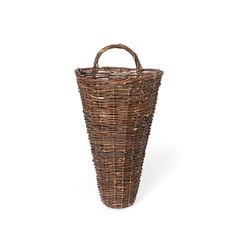 a brown wicker basket sitting on top of a white background with the handle down