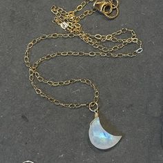 A gorgeous carved and faceted rainbow moonstone crescent moon is wired onto your choice of 14k gold filled, sterling silver, or 14k rose gold chain. This style is so current and pretty. Coordinating earrings are available. This listing is for the necklace only. Please choose your necklace length or the standard 18" will be sent. The default is the metal shown if you do not choose a metal. Your jewelry will arrive beautifully giftboxed. 14k Gold Filled Moon Jewelry Gift, 14k Gold Filled Dainty Moon Jewelry, Dainty 14k Gold Filled Moon Jewelry, Delicate 14k Gold Filled Jewelry With Moon Charm, Minimalist Hand Forged Moonstone Jewelry, Delicate Moonstone Moon Shaped Jewelry, Dainty Wire Wrapped Moonstone Jewelry, Dainty Crescent Moonstone Jewelry, Dainty 14k Gold Filled Moon-shaped Jewelry