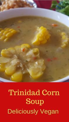 a white bowl filled with corn soup on top of a table