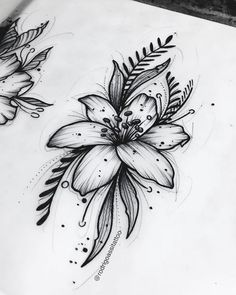 a drawing of flowers and leaves on paper