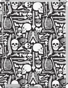 an ipad case with skulls and bones in black and white on the front, as well as