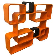 an orange shelf with two black shelves on each side