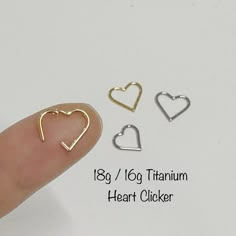 three heart shaped charms are shown in different colors and sizes on the thumbnails