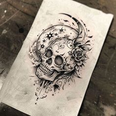 a drawing of a skull with flowers on it's head and stars around its neck