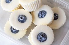 blueberries and cream filled pastries in a plastic container