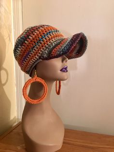 Unique, Fun and One of a Kind ~ Crochet Baseball Cap and Earring Set This DARE To Be Different cute and sassy Crochet Baseball Hat and Matching Earrings in beautiful colors will be sure to offer lots of warmth and chic style. In beautiful colors, this set will sure add that WOW factor to your outfit. Be beautiful while having a bad hair day.  Made from acrylic yarn this one will add tons of warmth and beauty on a cold day with the earrings to match. One size fits most ~ 21 inches For pierced ear Crochet Baseball Hat, Crochet Baseball, Nice Hats, Crochet Neck Warmer, Crochet Hat For Women, Pierced Ear