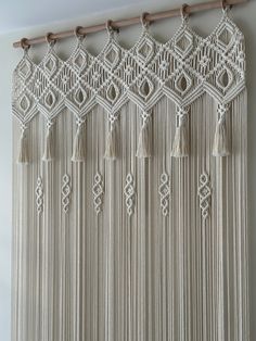 macrame wall hanging with tassels and beads