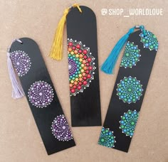 three bookmarks decorated with beads and tassels