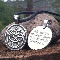 two pendants with the words, my spirit is strong than any obstacle before me