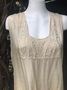 Pretty silk flapper dress. Ivory/beige fabric with embroidered bodice and and skirt. Drop waist. Very good clean vintage condition. On very close inspection there is a few tiny defects to the fabric. Not noticeable and does not detract. Measured flat Chest 49cm Waist  48cm Pit to drop waist 37cm Shoulder to hem 108cm Skirt from drop hem 41cm 1920s Style Cream Summer Dress, 1920s Cream Summer Dress, Cream 1920s Style Summer Dress, Puff Sleeve Dress Vintage, 1920 Dress, Beaded Flapper Dress, Embroidered Jumpsuit, Abstract Dress, 1920s Flapper Dress