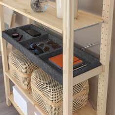 a shelf with sunglasses and other items on it