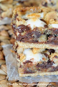 chocolate chip cookie bars stacked on top of each other with marshmallows in the middle