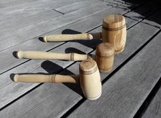 three wooden pegs sitting on top of a wooden table