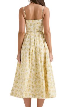 From garden party to daytime wedding, this dreamy midi sundress cut in a classic fit-and-flare silhouette shaped with a boned bodice precisely fits the bill. Exclusive retailer Hidden back-zip closure Scoop neck Adjustable straps Side-seam pockets Lined 65% cotton, 32% nylon, 3% elastane Dry clean Imported Feminine Fitted Yellow Floral Dress, Yellow Picnic Dress, Fitted Yellow Floral Sundress, Modest Sundress, Yellow Fitted Cottagecore Dress, Classic Sundress, Summer Sun Dresses, Yellow House Of Cb Dress, House Of Cb Yellow Dress