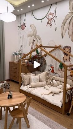 a child's room with a wooden bed and monkey themed wallpaper