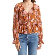 Spring Florals Are Here! The Deets: Ruffle Vneck Floral Blouse | Size Xs | Color: Burnt Orange + Gorgeous Pink/White Floral Print Throughout | Perfectly Paired For The Office W. A Pencil Skirt Or Pants Or Casual Cute For Date Night Or Brunch W. Your Fav Denim | Features: Ruffle V Neck + Sheer Balloon Sleeves + Elastic Drawstring Waist + Lined Throughout Minus The Sleeves + Fits Up To A Small + Machine Washable On Delicate | 17” Bust + 22” Length | 100% Polyester | Contact For Questions | No Trad Feminine V-neck Top With Ruffle Hem, Fall V-neck Top With Ruffle Hem, Pink V-neck Blouse With Ruffles, Fall V-neck Ruffled Tops, Feminine V-neck Tops For Brunch, Feminine V-neck Top For Spring, Feminine V-neck Top For Fall, Pink Ruffled V-neck Blouse, Spring V-neck Top With Ruffle Hem