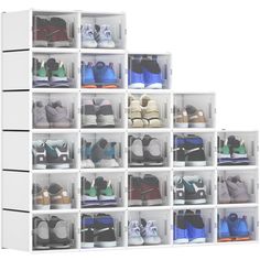 a white shelf filled with lots of pairs of shoes