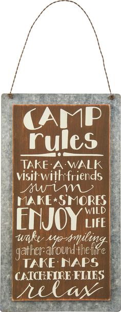 a sign that says camp rules on it