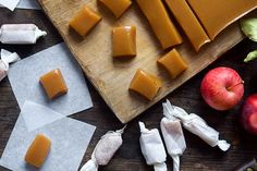 several pieces of cheese sitting on top of a cutting board