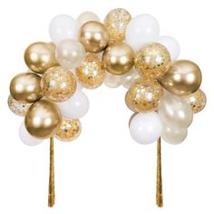 some gold and white balloons are on top of each other in the shape of flowers