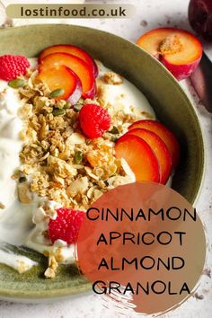 a bowl filled with yogurt, fruit and granola on top of a table