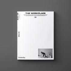 the workplace book is open on a gray background with black and white images