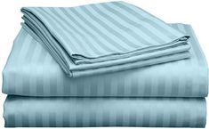 two sheets are folded on top of each other, one is blue and the other is white