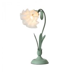 a light that is on top of a white table lamp in the shape of a flower