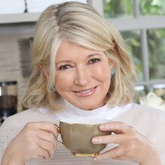 a woman holding a coffee cup in her hands