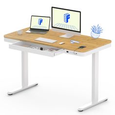 a computer desk with two computers on it