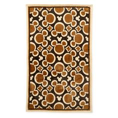 a brown and white rug with circles on it