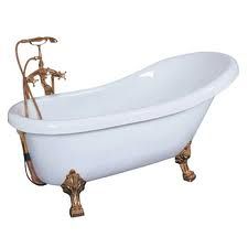 an old fashioned claw foot bathtub with gold faucet handles and brass fixtures