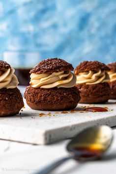 chocolate cookies with frosting and peanut butter on top