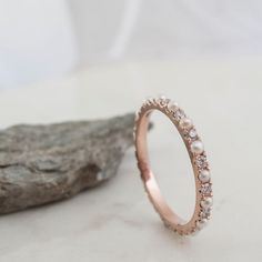 a close up of a ring on a rock