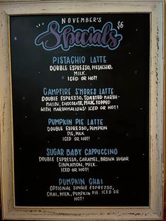 the menu for specials is displayed on a blackboard