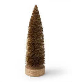 a small tree made out of wood on a white background