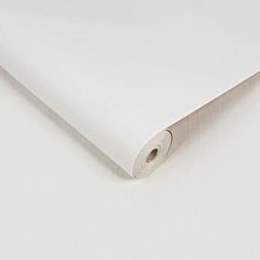 a plain white sheet is folded up on the table