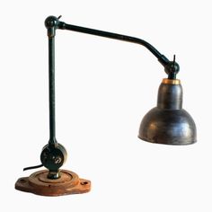 an old fashioned desk lamp on a white background with clipping off the light bulb