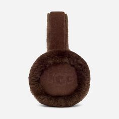 Featuring our world-renowned sheepskin and embroidered logo detailing, these ultra-soft earmuffs are iconically UGG®. Offering premium protection for your chilliest days. | Sheepskin earmuff. Self - 100% Sheepskin. Lining - Unlined. Water resistant. The UGG® Logo embroidered on ears. Imported. | UGG® Women's Sheepskin Embroidery Earmuff Earmuffs in Burnt Cedar Ugg Earmuffs, Cozy Accessories, Ear Muffs, Fall Birthday, Creature Comforts, Cool Countries, Winter Aesthetic, Cold Weather Accessories, Leather Cleaning