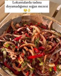 a bowl filled with food on top of a wooden table