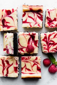 raspberry swirl cheesecake squares on a white surface