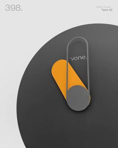 an orange and gray sign with the word on it's side next to a black circle