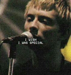 a man singing into a microphone with the words i wish i was special on it