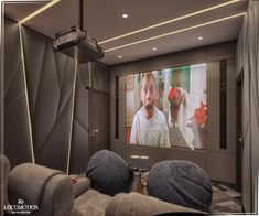 a home theater with two seats and a large screen on the wall behind it,