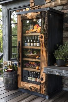 a wooden cabinet filled with lots of bottles next to a table and potted plants