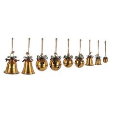 six brass bells with bows hanging from the top, all lined up in a row