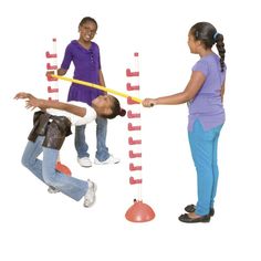 three children playing with an obstacle set on a white background and one child is reaching for it