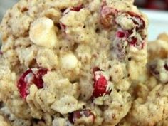 cookies with cranberries and white chocolate chips are stacked on top of each other