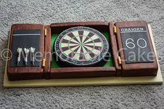 a dart board and darts in a wooden case